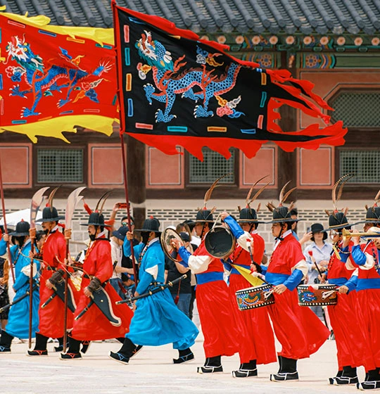 Royal guards performing a traditional ceremony in Seoul, a top cultural experience on South Korea tours.